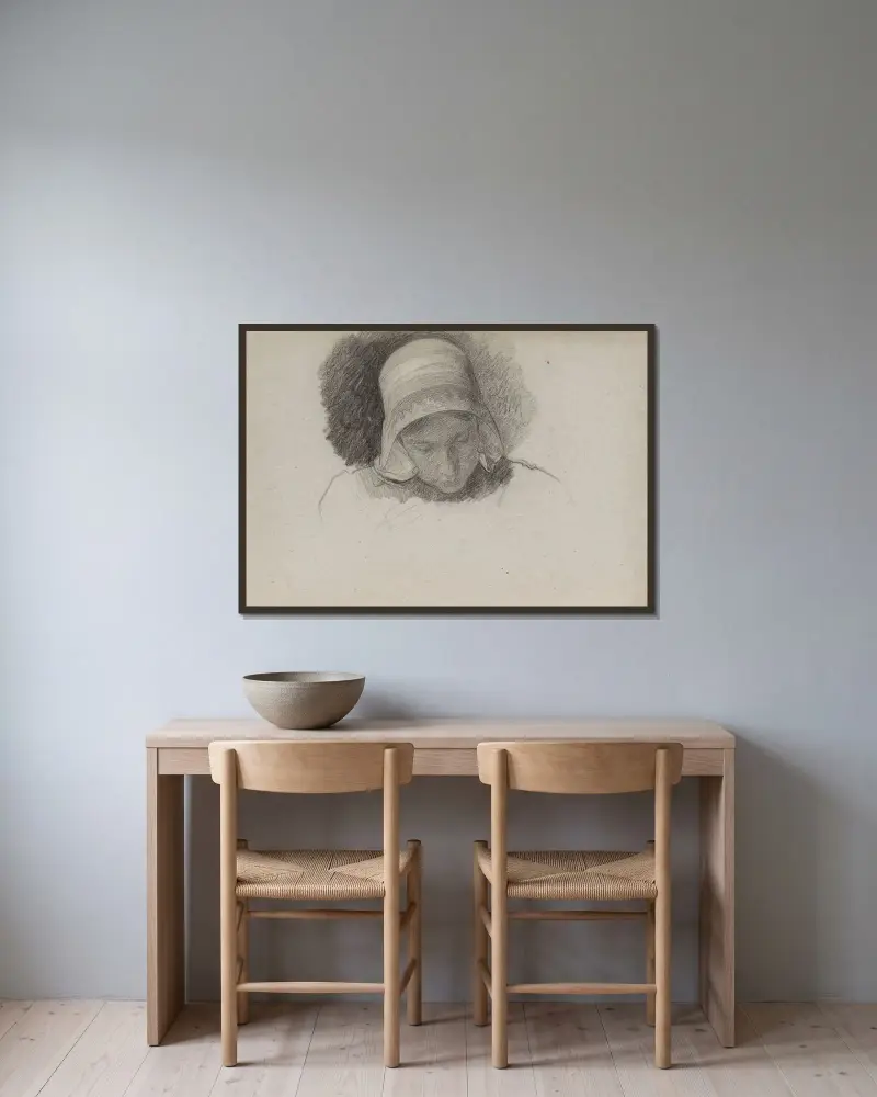 Kopia av en flicka med bondmössa av Jan Veth inramad på en vägg