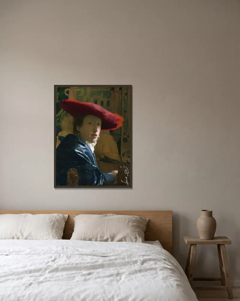 Girl with the Red Hat av Johannes Vermeer inramad på en vägg