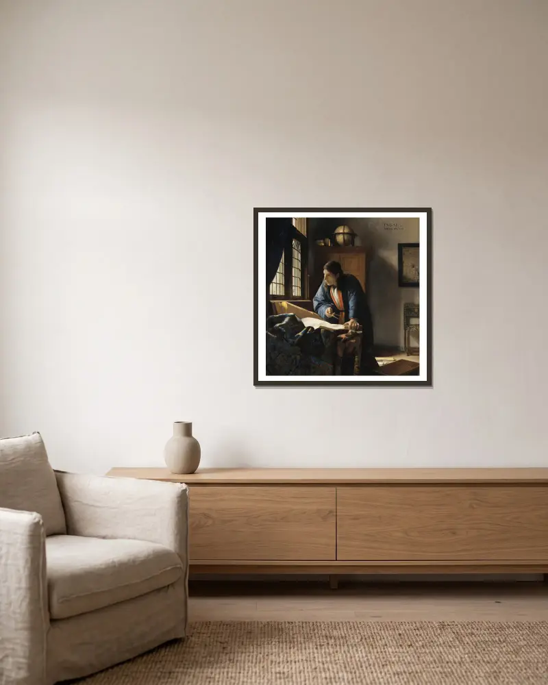 Der Geograph von Johannes Vermeer gerahmt an einer Wand