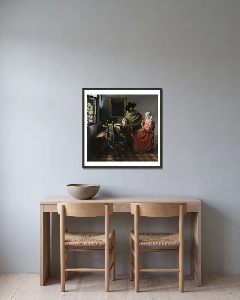 The Wine Glass av Johannes Vermeer inramad på en vägg
