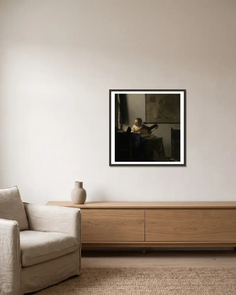 Junge Frau mit einer Laute von Johannes Vermeer gerahmt an einer Wand