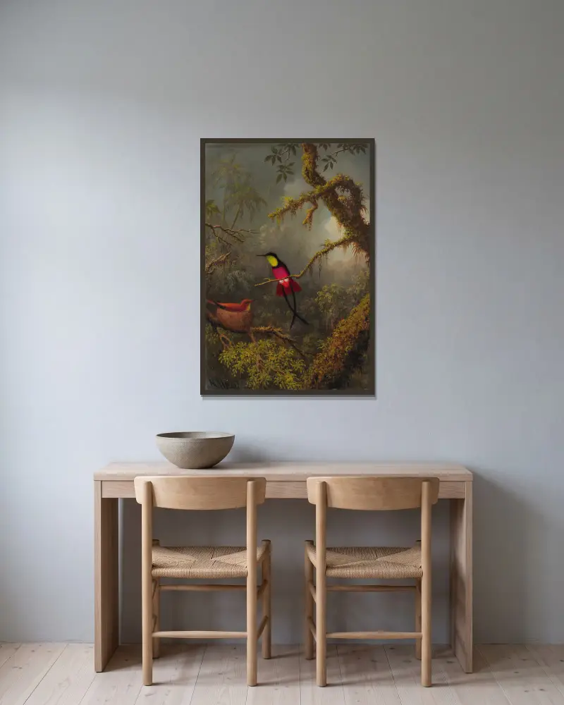 Ett par häckande röda topaskolibrier av Martin Johnson Heade inramad på en vägg