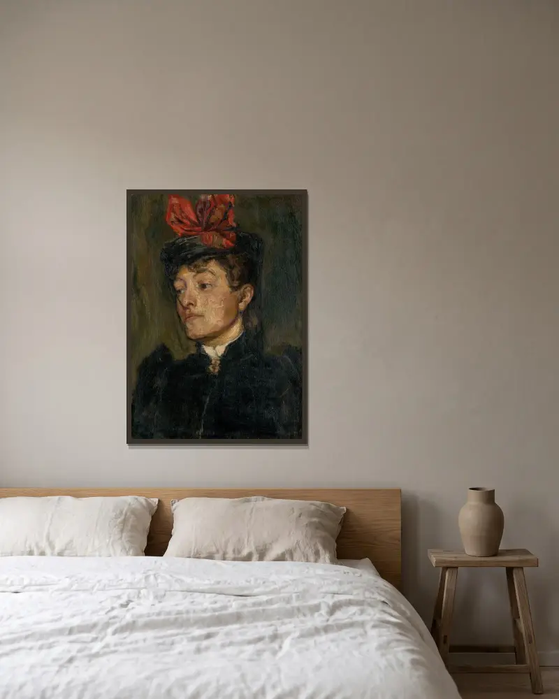 Huvud av dam i hatt av Jozef Hanula inramad på en vägg