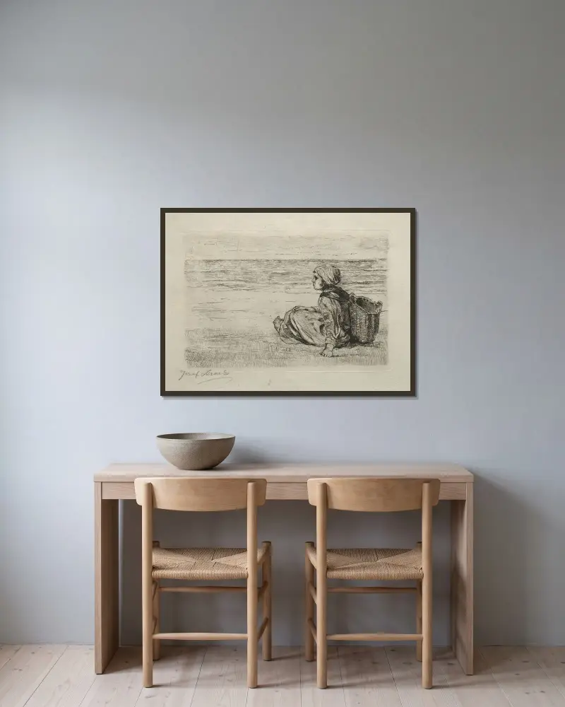 Flicka med korg sittande på stranden av Jozef Israëls inramad på en vägg