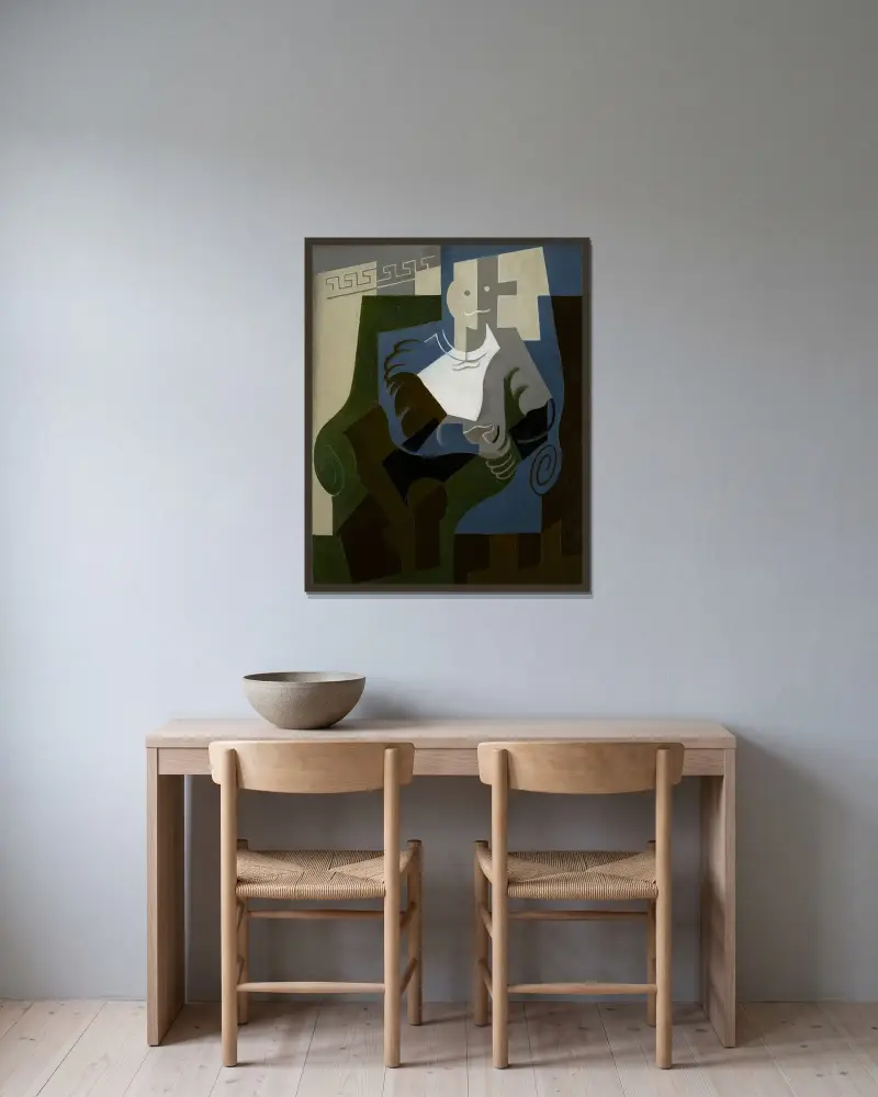 Sittande Harlekin av Juan Gris inramad på en vägg