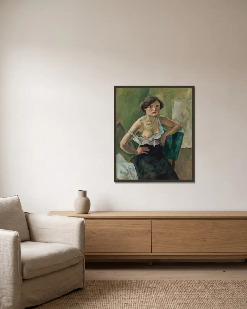 Ung kvinna på grön stol av Jules Pascin inramad på en vägg