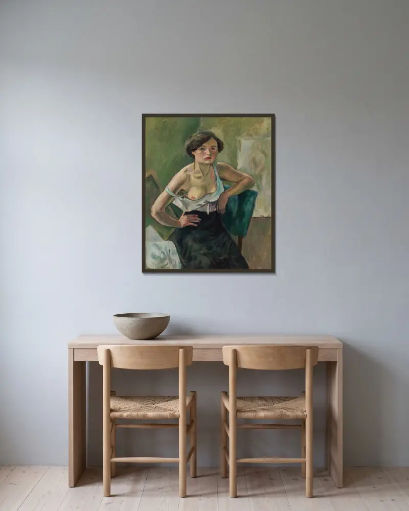 Ung kvinna på grön stol av Jules Pascin inramad på en vägg