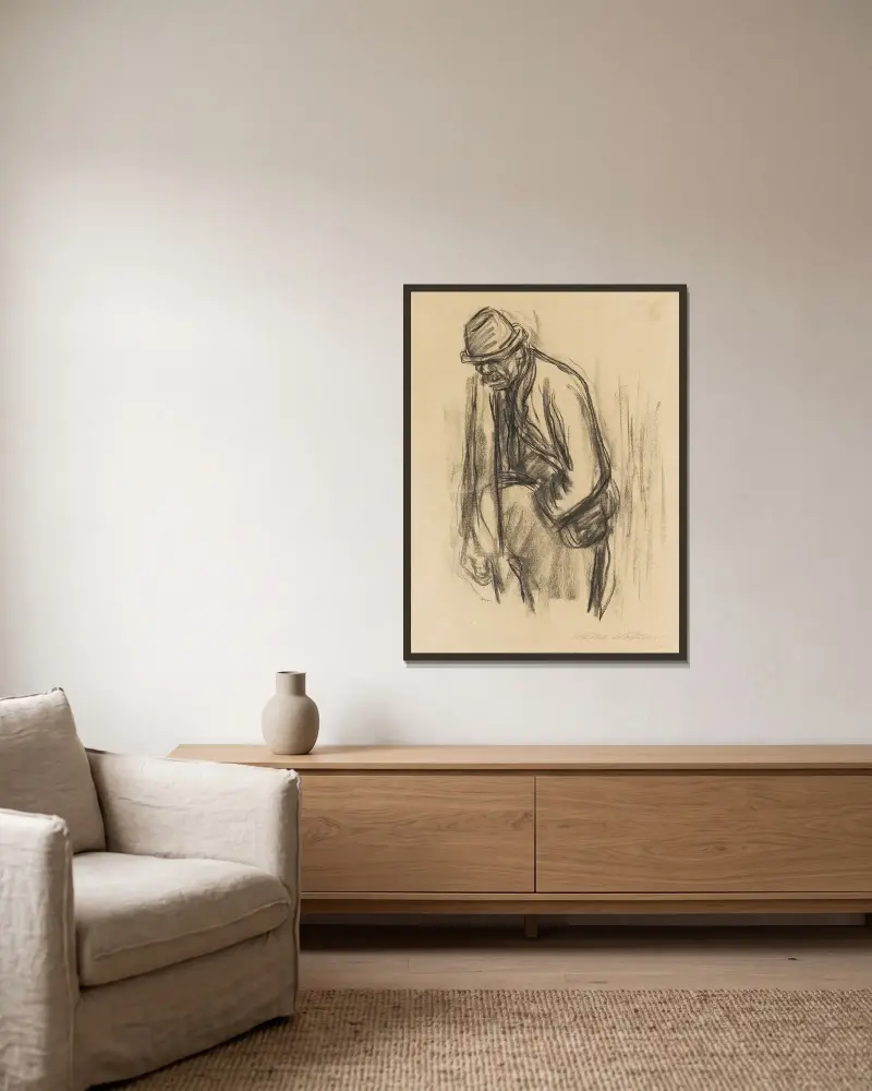 Mann mit Hut von Käthe Kollwitz gerahmt an einer Wand