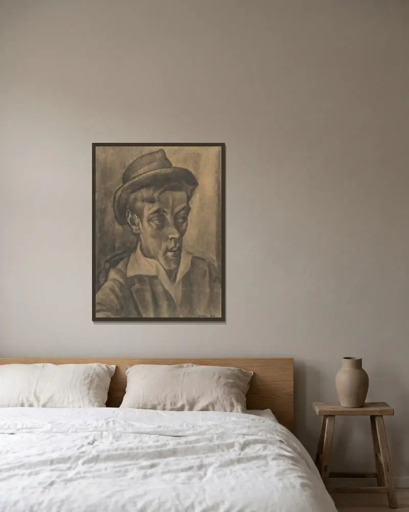 Byst av man med hatt av Leo Gestel inramad på en vägg