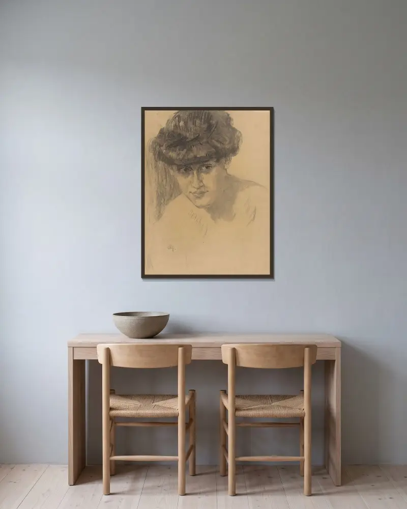 Byst av en kvinna med uppsatt hår av Leo Gestel inramad på en vägg