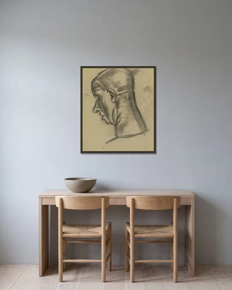 Mannenkop 3 av Leo Gestel inramad på en vägg