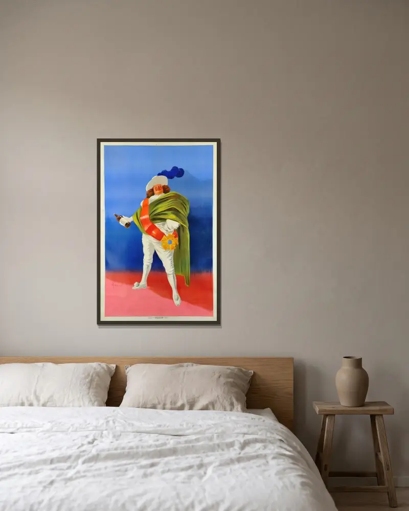 Affisch för en likör av Leonetto Cappiello inramad på en vägg