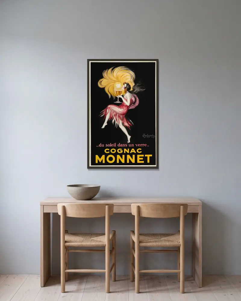 Cognac Monnet av Leonetto Cappiello inramad på en vägg
