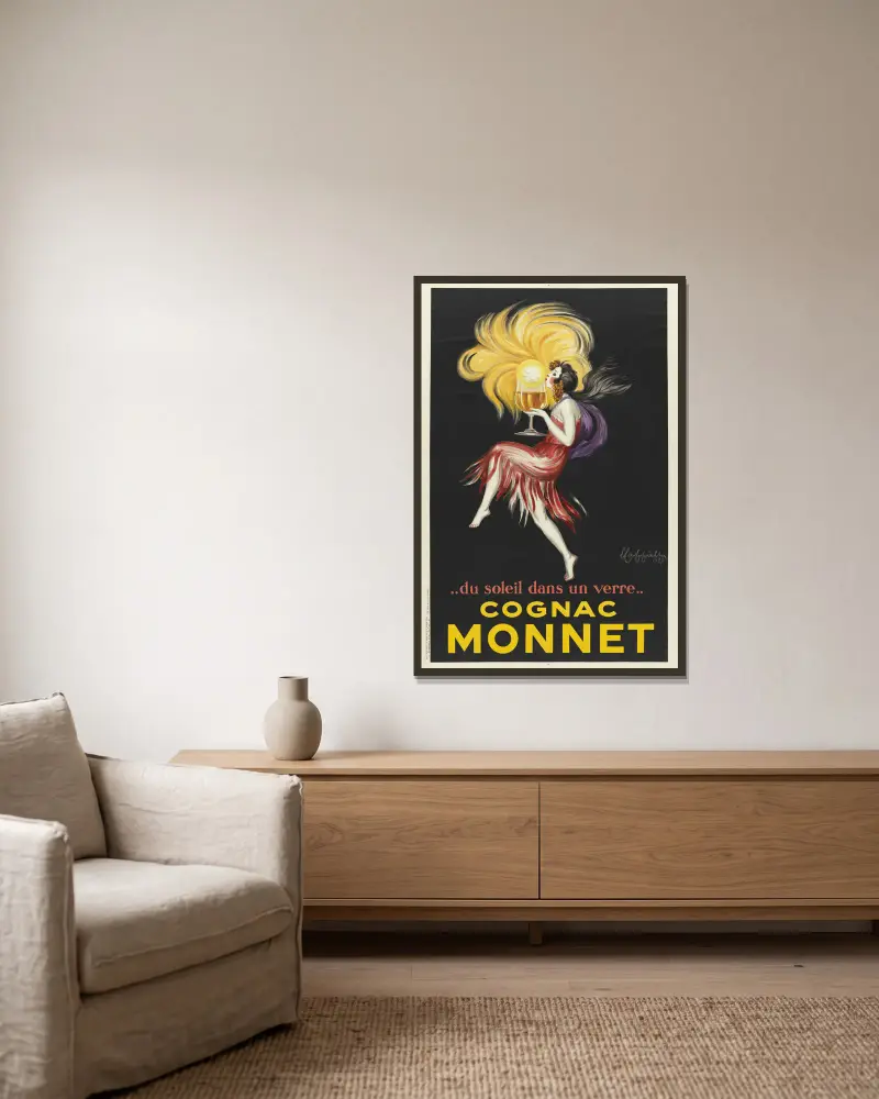 Du soleil dans un verre. Cognac Monnet av Leonetto Cappiello inramad på en vägg