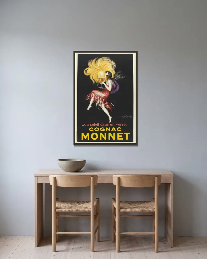 Du soleil dans un verre. Cognac Monnet av Leonetto Cappiello inramad på en vägg