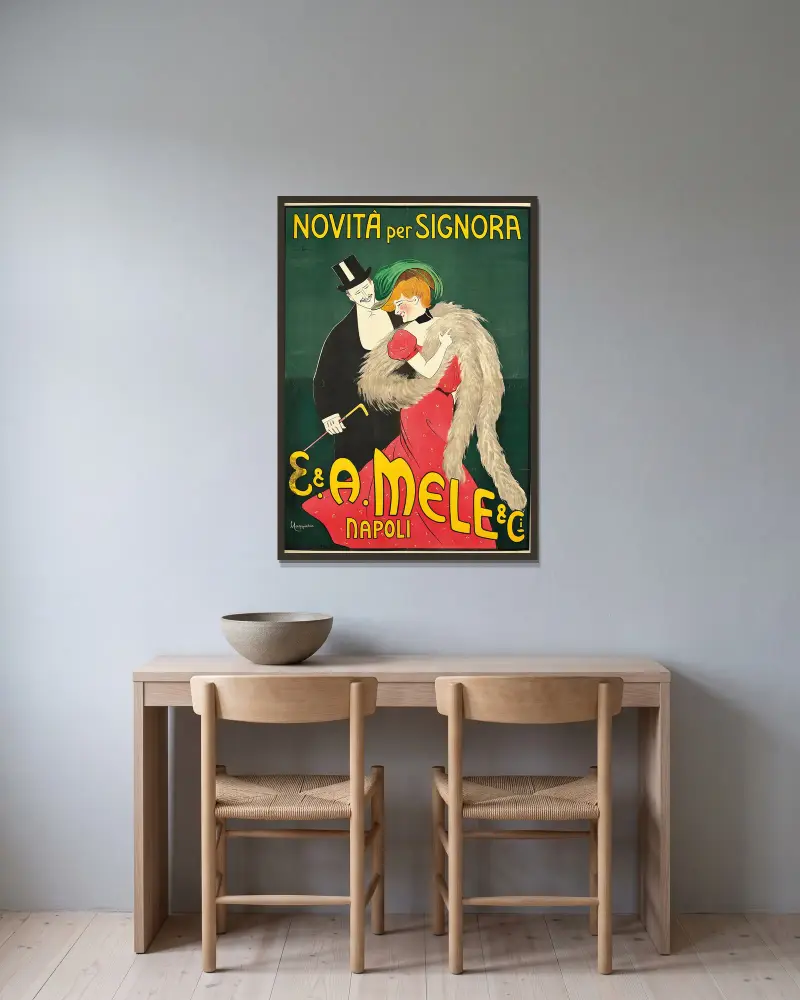 E. And A. Mele And Ci av Leonetto Cappiello inramad på en vägg