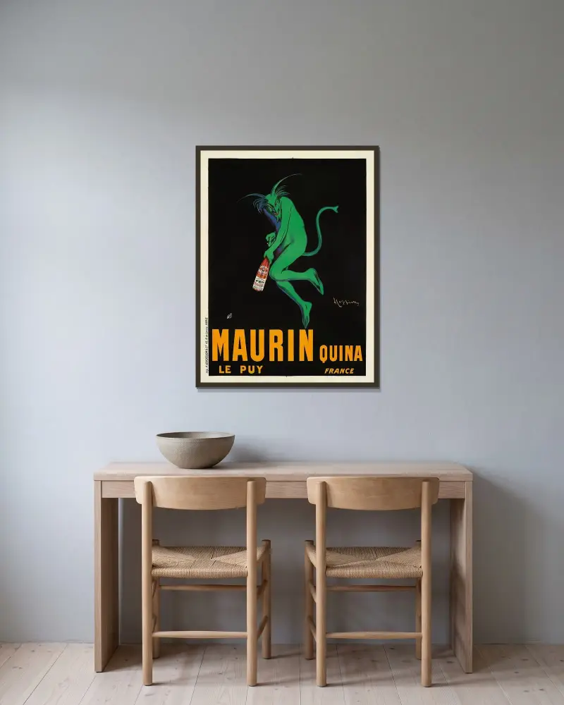 Maurin Quina av Leonetto Cappiello inramad på en vägg