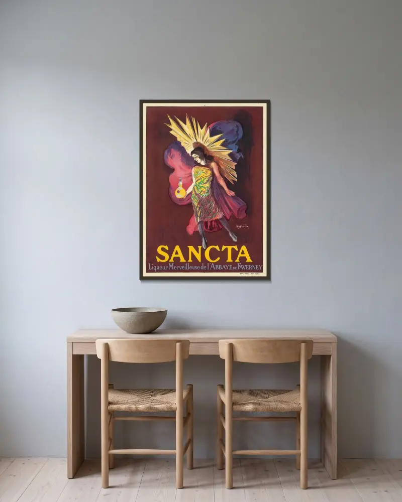 Sancta av Leonetto Cappiello inramad på en vägg