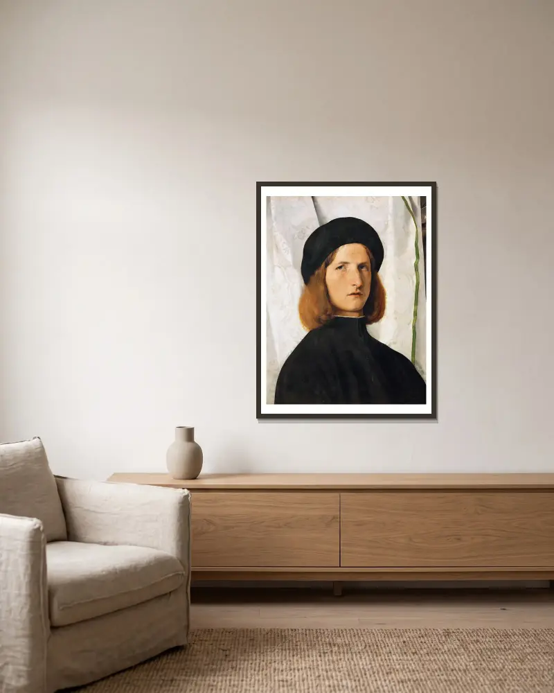 Portrait of a Young Man with a Lamp av Lorenzo Lotto inramad på en vägg