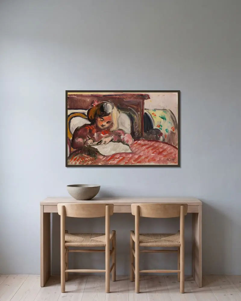 Skrivande barn av Louis Valtat inramad på en vägg