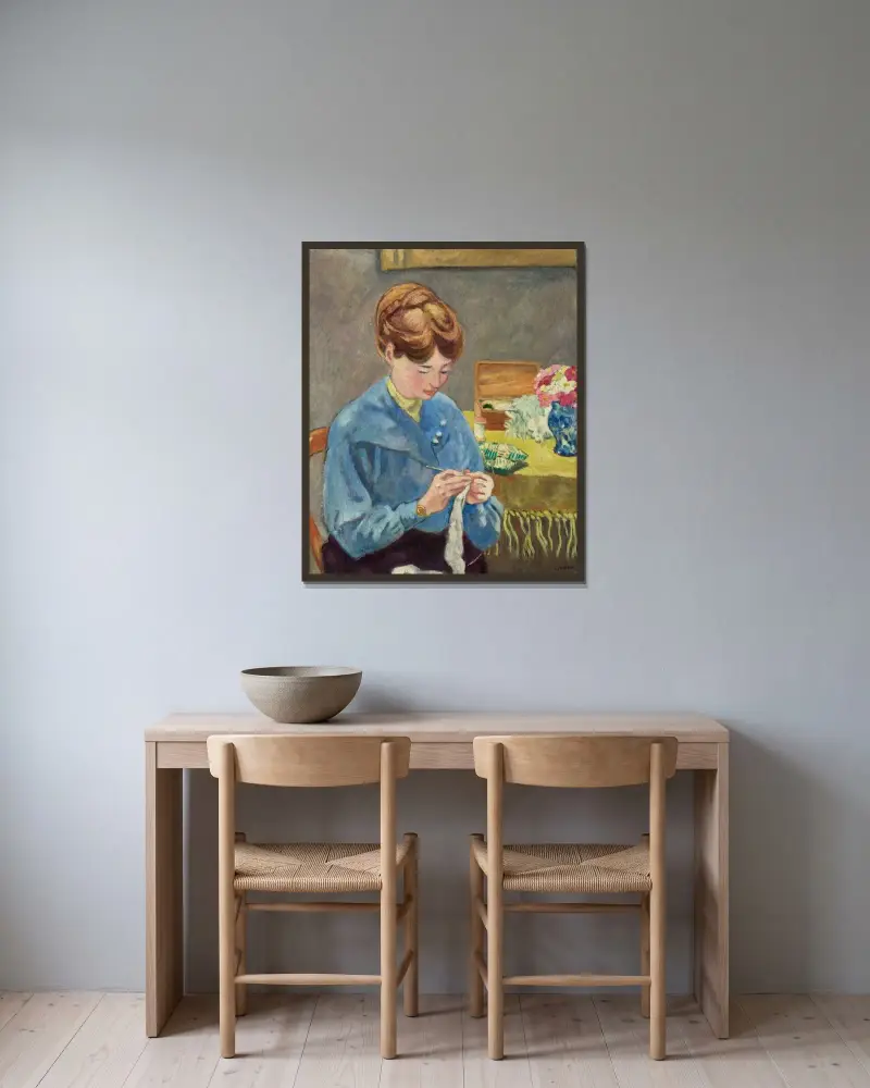 Kvinna som stickar av Louis Valtat inramad på en vägg