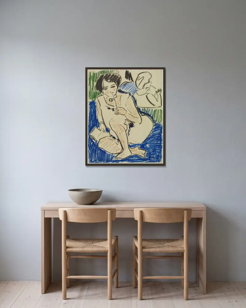 Hockende mit Buch von Ernst Ludwig Kirchner gerahmt an einer Wand