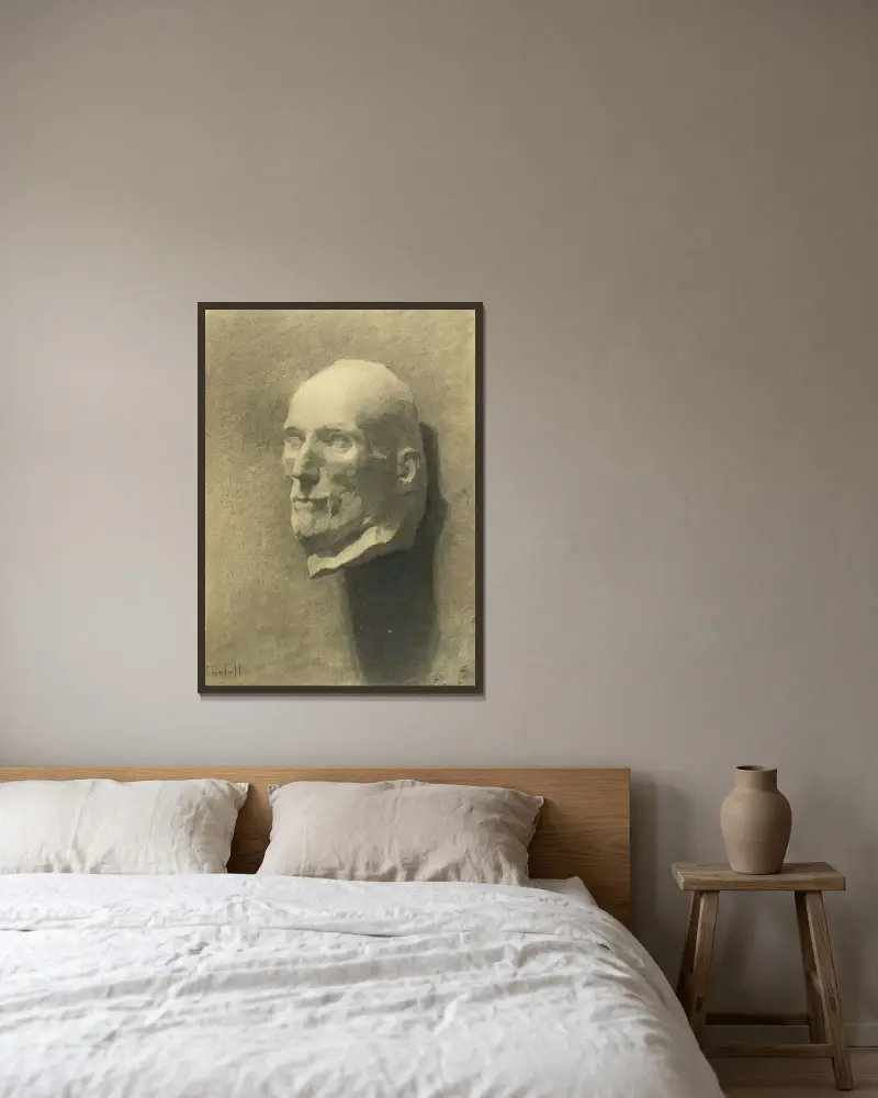 Manshuvud av Magnus Enckell inramad på en vägg