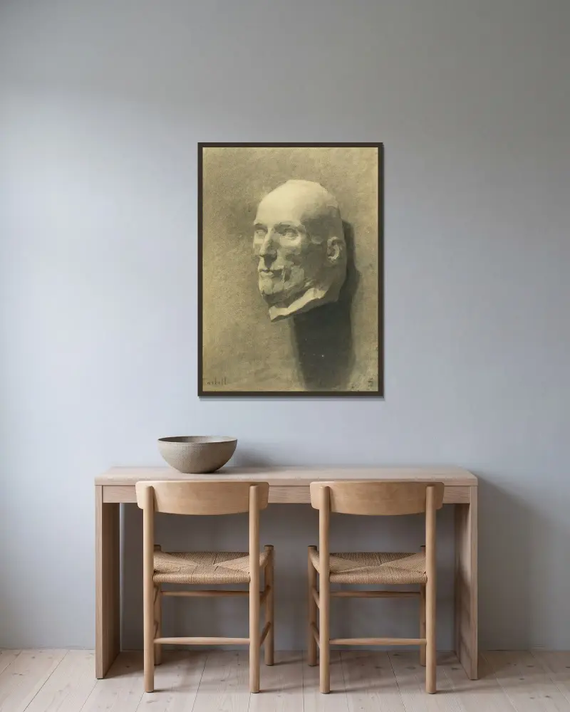 Manshuvud av Magnus Enckell inramad på en vägg