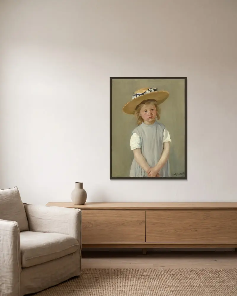 Child in a Straw Hat av Mary Cassatt inramad på en vägg