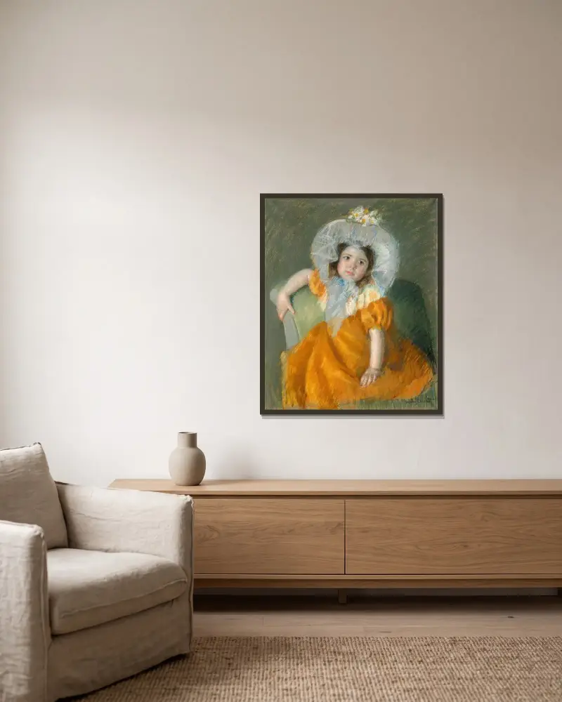 Margot in Orange Dress av Mary Cassatt inramad på en vägg