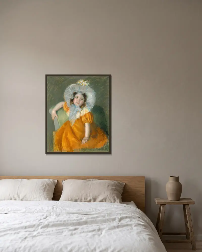 Margot in Orange Dress av Mary Cassatt inramad på en vägg