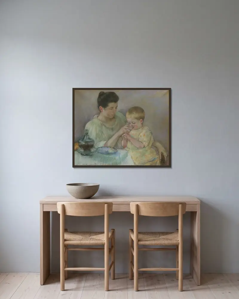 Mother Feeding Child av Mary Cassatt inramad på en vägg