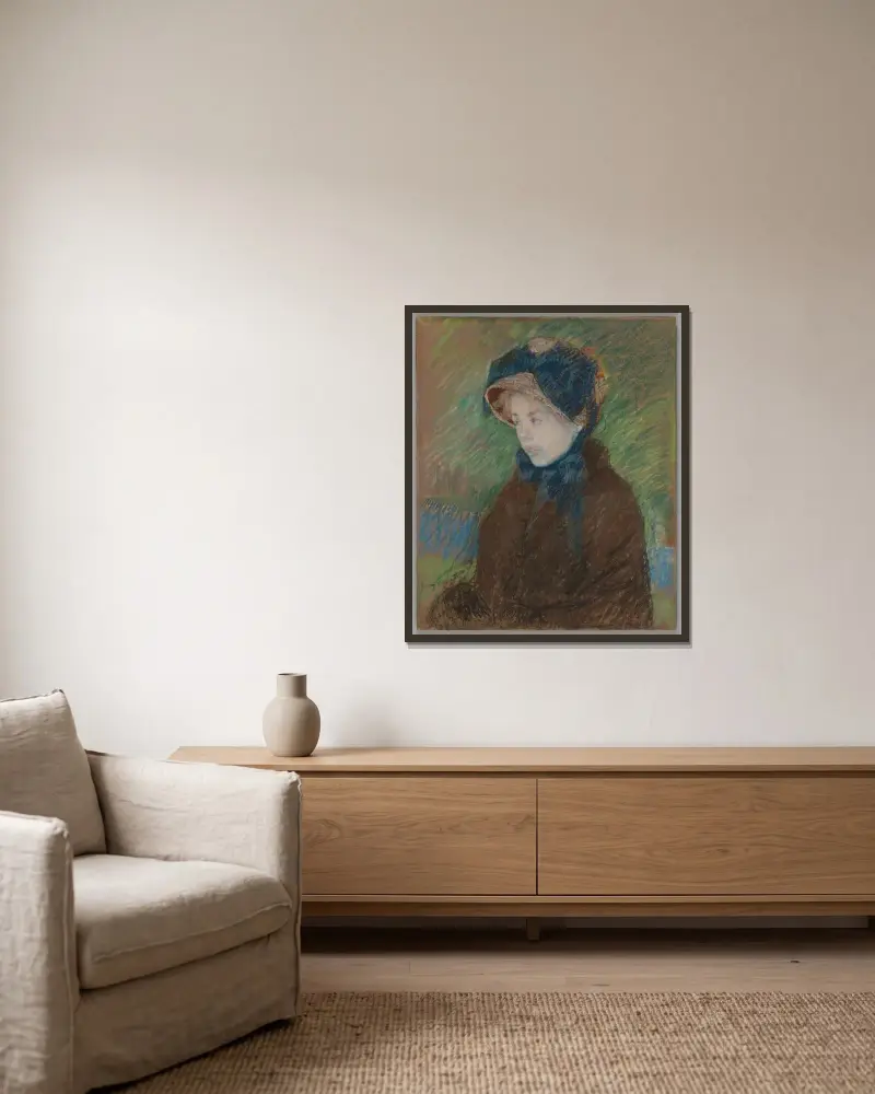 Susan in a Straw Bonnet av Mary Cassatt inramad på en vägg