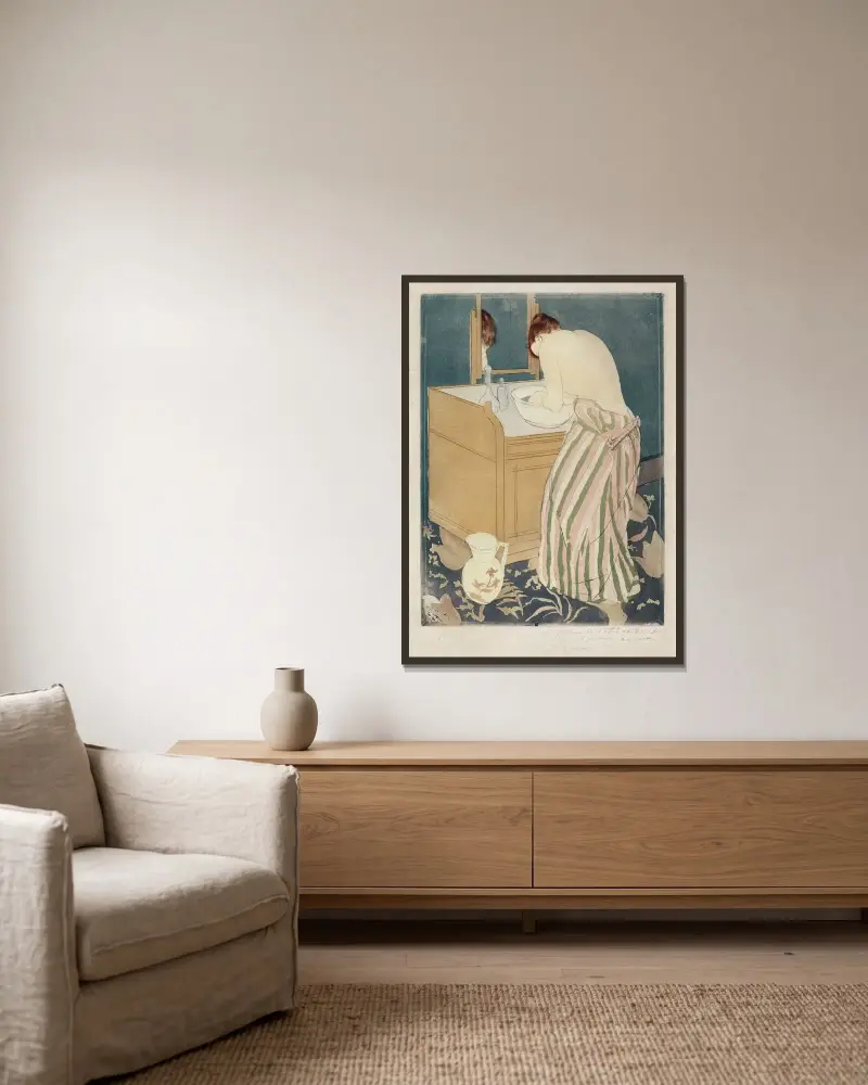 Frau beim Baden von Mary Cassatt gerahmt an einer Wand