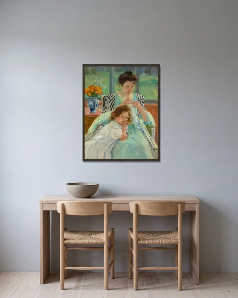 Young Mother Sewing av Mary Cassatt inramad på en vägg