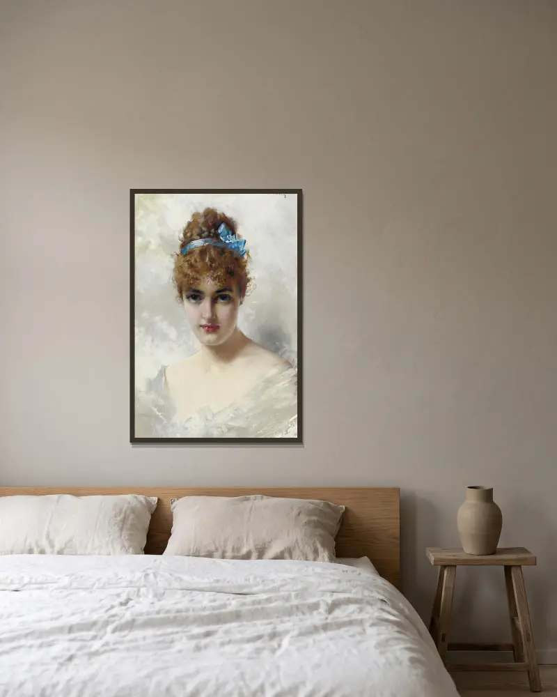 Porträtt av en ung kvinna i vitt av Vittorio Matteo Corcos inramad på en vägg