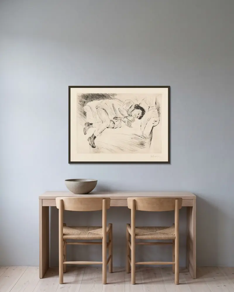Barn liggande på soffa av Max Liebermann inramad på en vägg