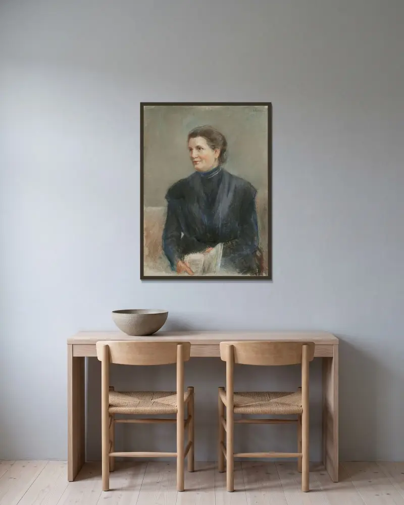 Läspaus (Porträtt av Margarete Ladenburg) av Max Liebermann inramad på en vägg
