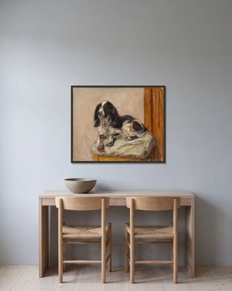 Liggande spaniel av Max Liebermann inramad på en vägg