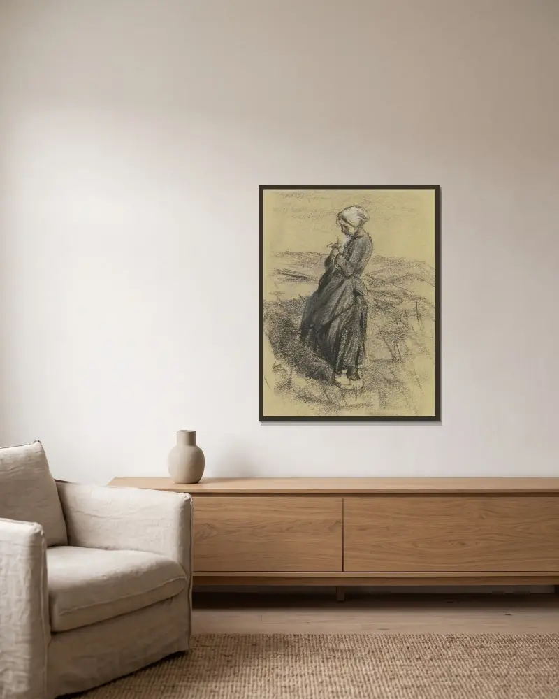 Flicka på fältet, stickande av Max Liebermann inramad på en vägg