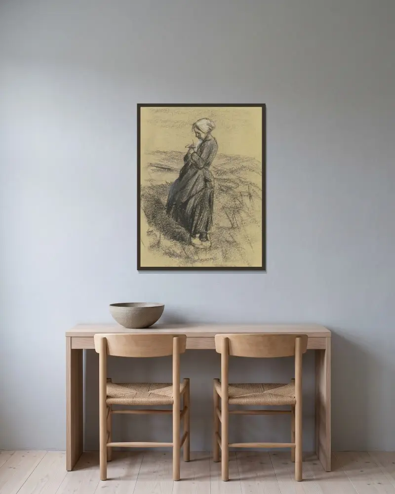 Flicka på fältet, stickande av Max Liebermann inramad på en vägg