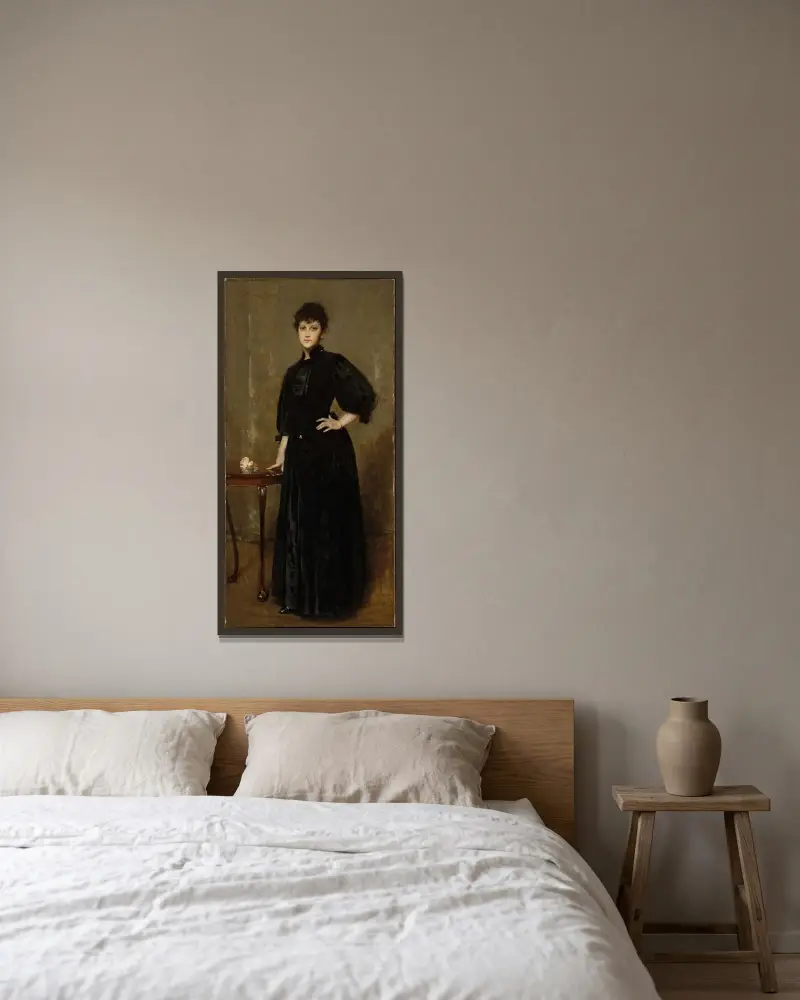 Dam i svart av William Merritt Chase inramad på en vägg