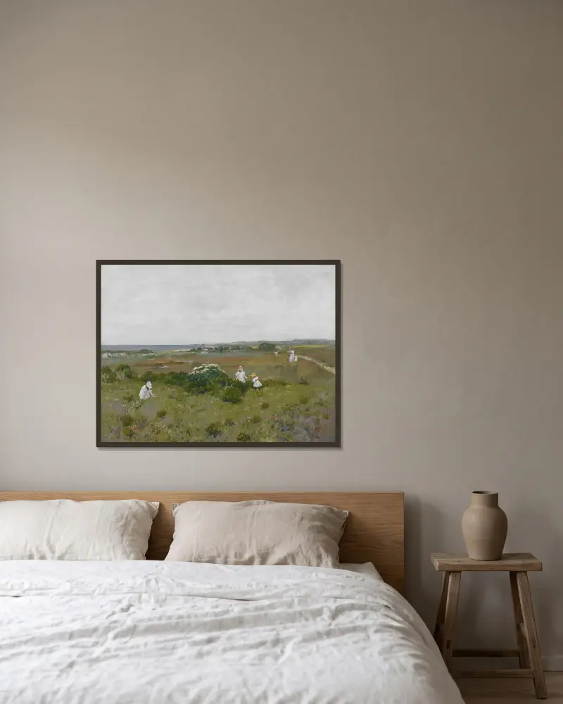 Blommor vid havet av William Merritt Chase inramad på en vägg