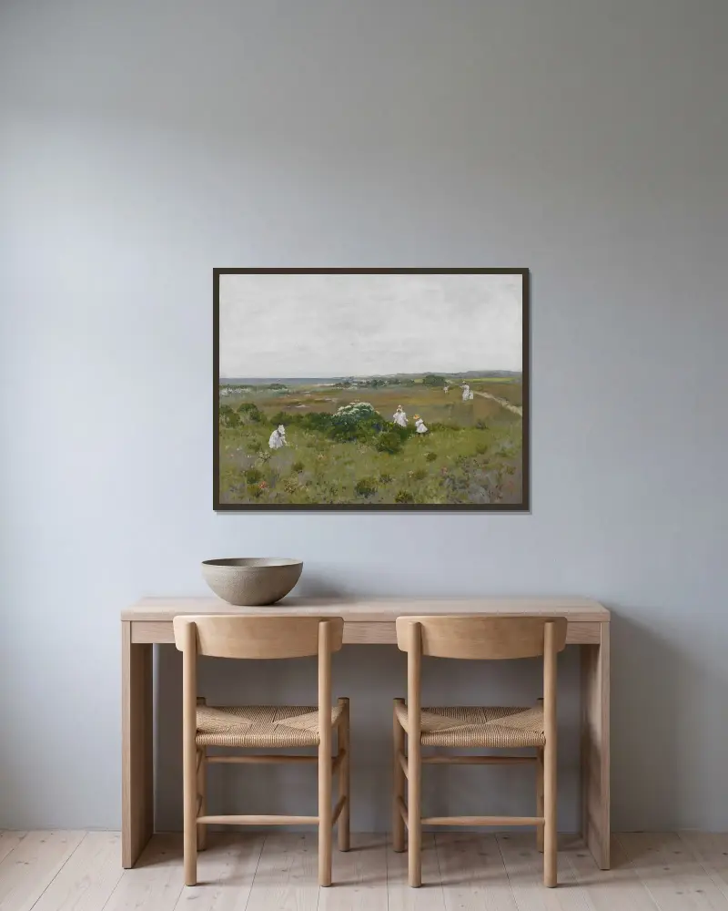 Blommor vid havet av William Merritt Chase inramad på en vägg