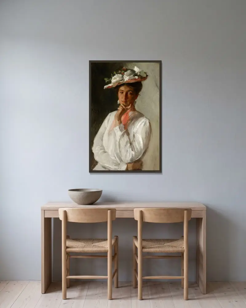Frau in Weiß von William Merritt Chase gerahmt an einer Wand
