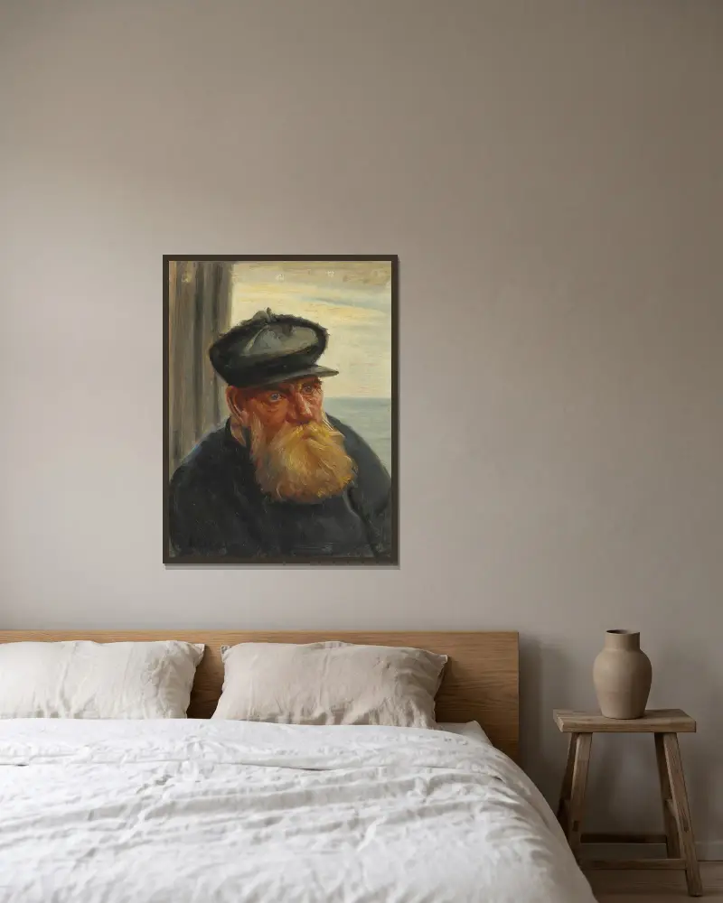 En skagensfisker med havet i baggrunden av Michael Ancher inramad på en vägg