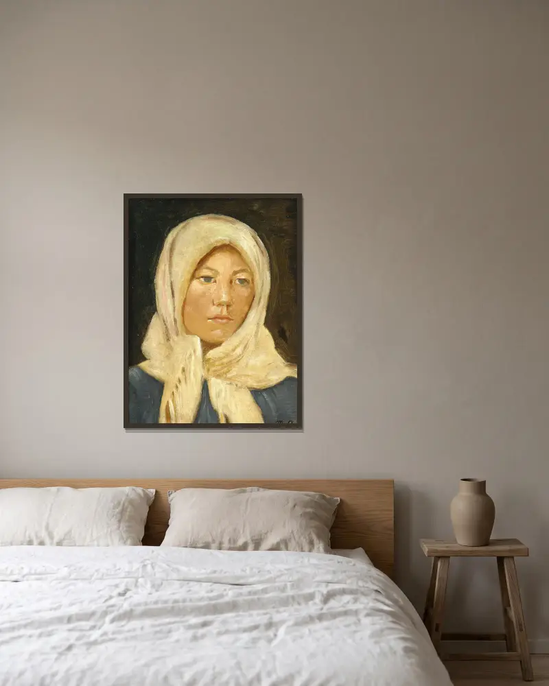 En ung skagenspige med tørklæde av Michael Ancher inramad på en vägg