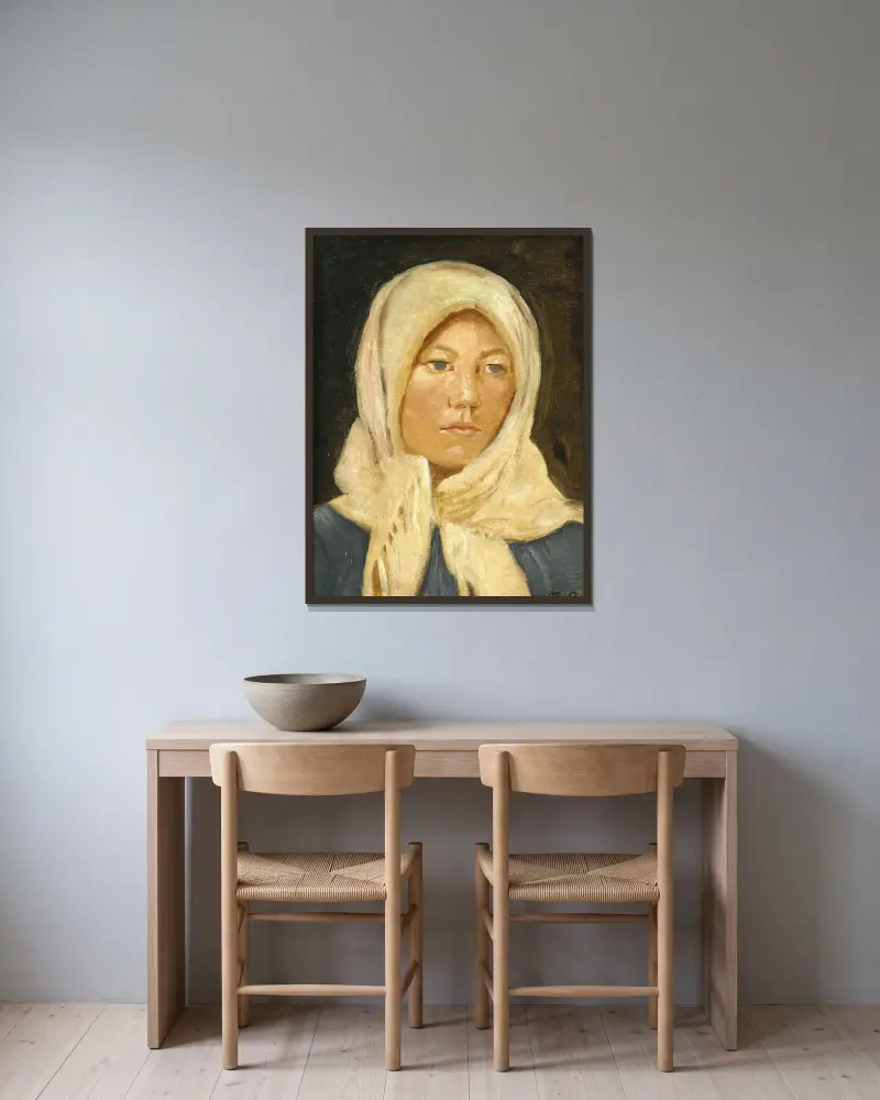 En ung skagenspige med tørklæde av Michael Ancher inramad på en vägg