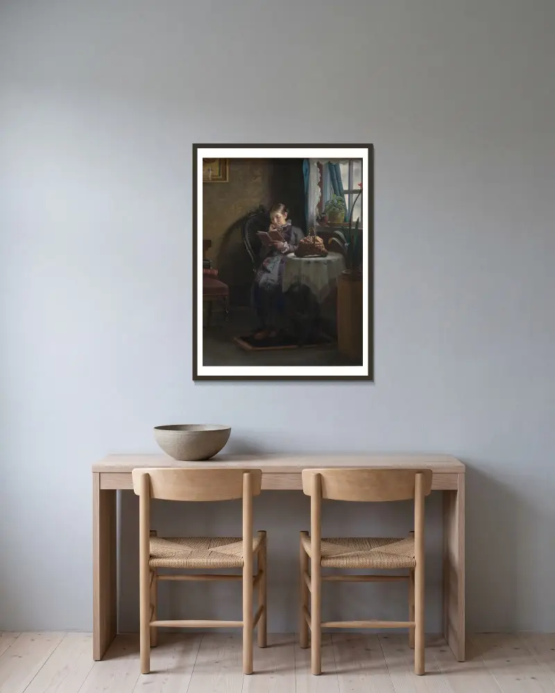 The Artist’s Wife Reading av Michael Ancher inramad på en vägg