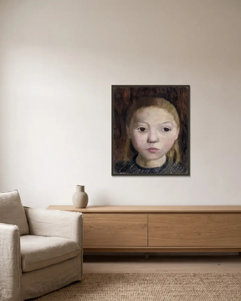 Mädchenkopf von Paula Modersohn-Becker gerahmt an einer Wand